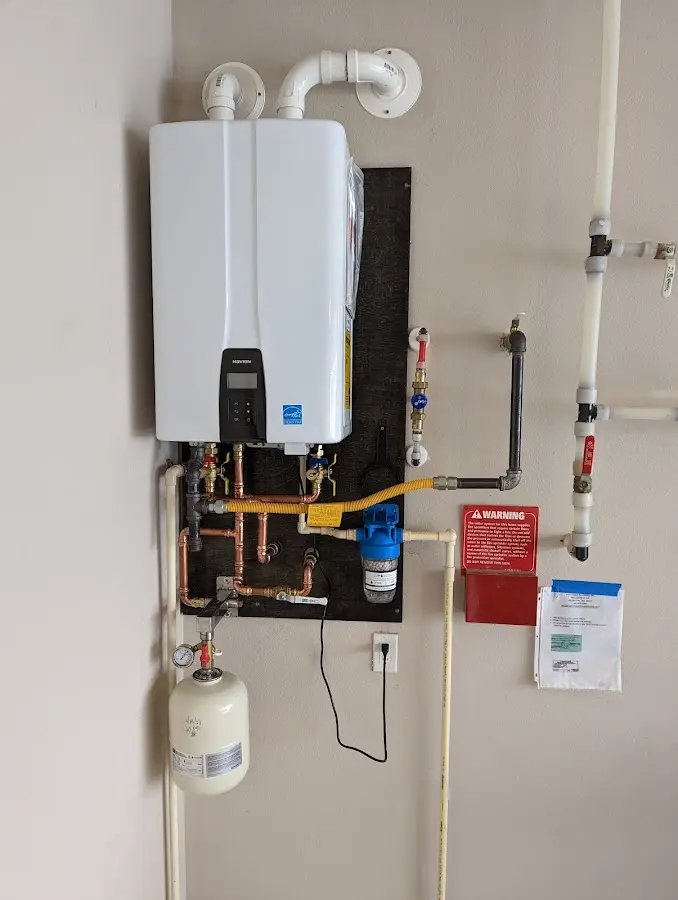 Professional plumber installing copper piping in a Yarmouth home